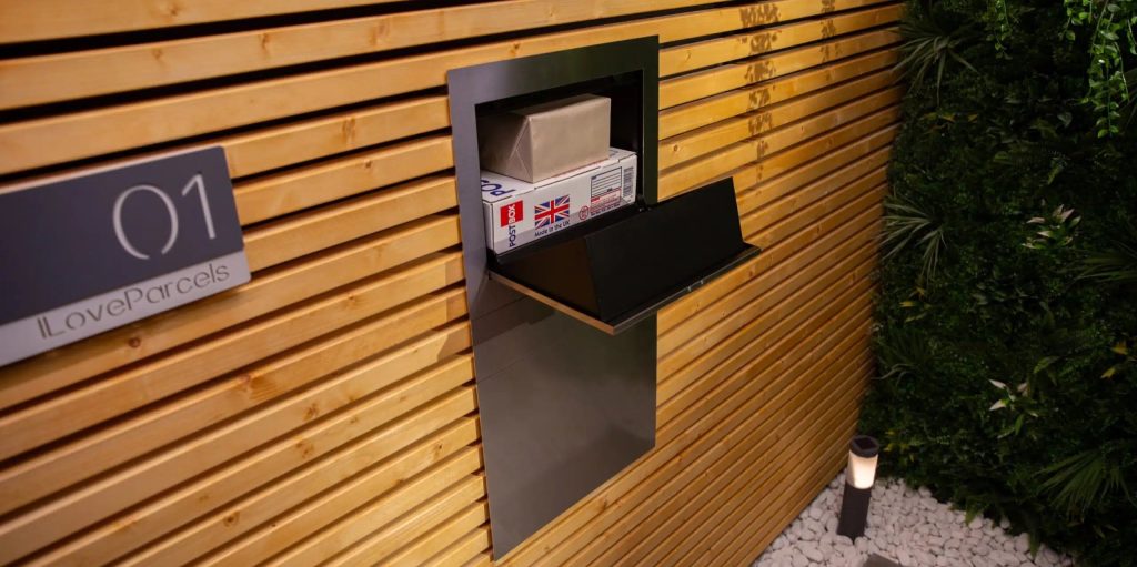 Parcel box mounted on a fence open